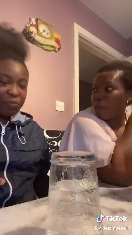 Daughter Pranks Mom By Turning Over Glass Full of Water on Table