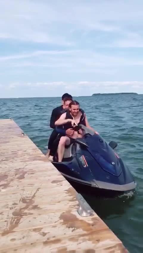 Three Guys Fall Into Water As Jet Ski Topples Over