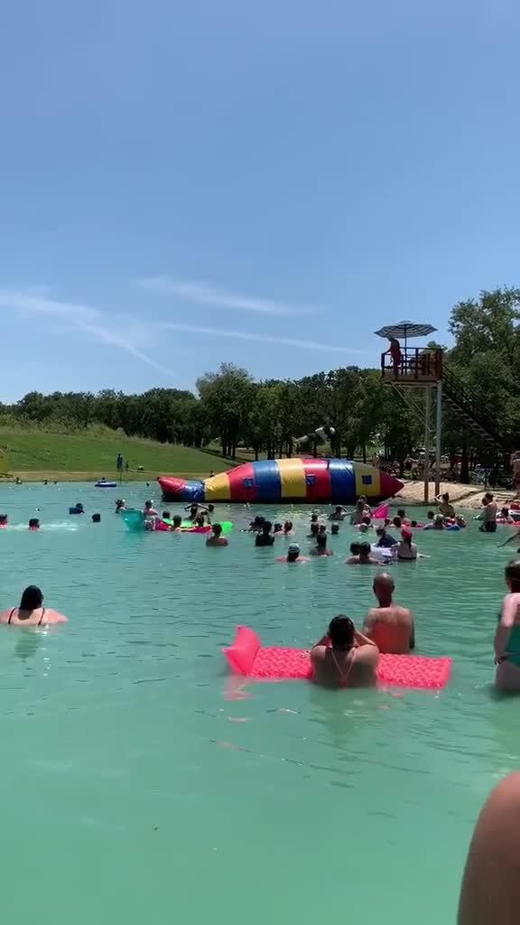Boy Flies off an Inflatable Float as Another Guy Jumps on it