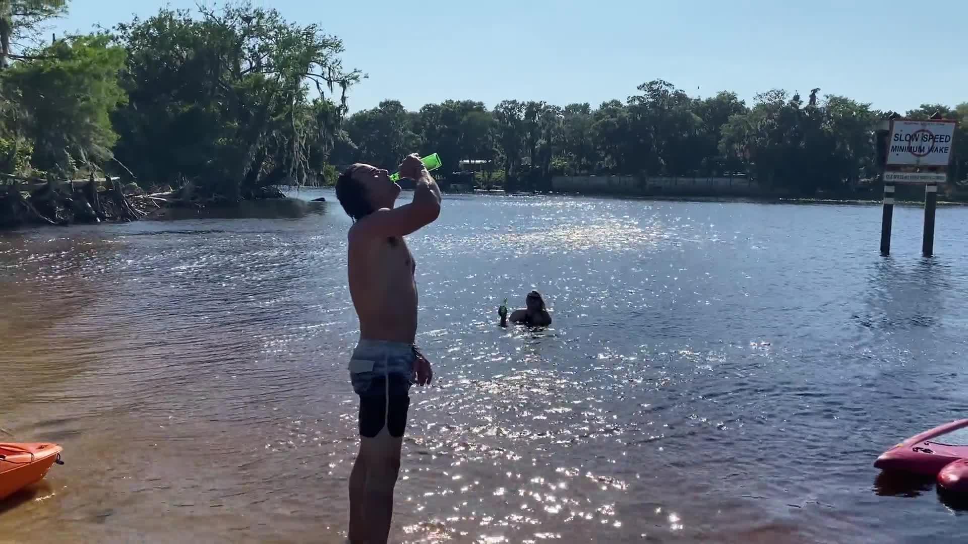 Guy Attempting to Backflip off Paddleboard Slips and Plops in Water