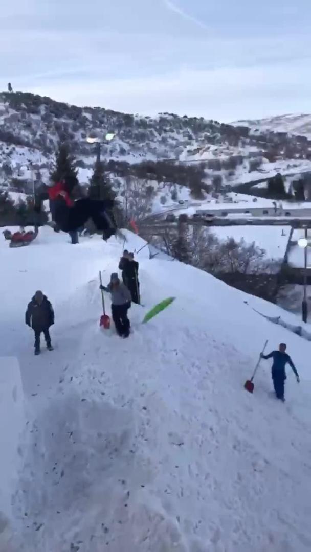 Guy Loses Sledge While Jumping Off Snow Ramp