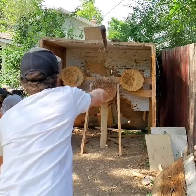 Guy Throws Spear Through Ring and Pins Them Both to Target