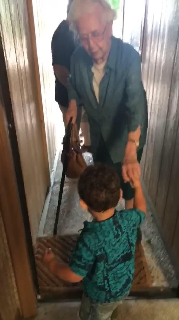 Toddler Helps Great-Grandma Walk Through Narrow Hallway