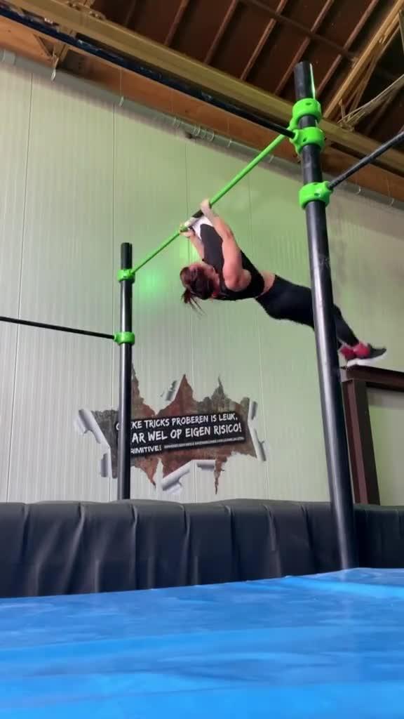 Girl's Shirt Gets Stuck on Pull-up Bar And Rips While Performing Acrobatic Trick
