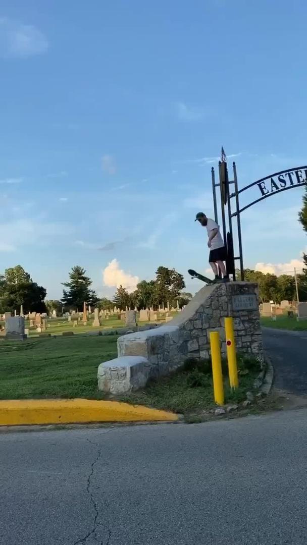 Guy Faceplants on Road While Skateboarding on Concrete Slope